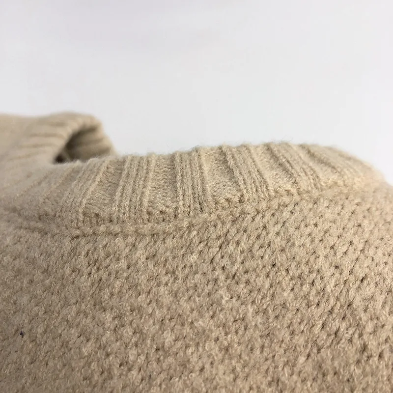 Textura tejida del suéter infantil