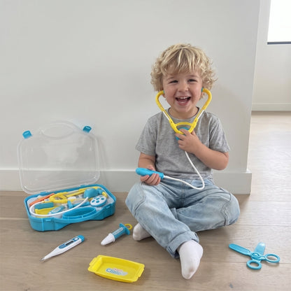 Maletín de juguete abierto con accesorios de doctor para niños