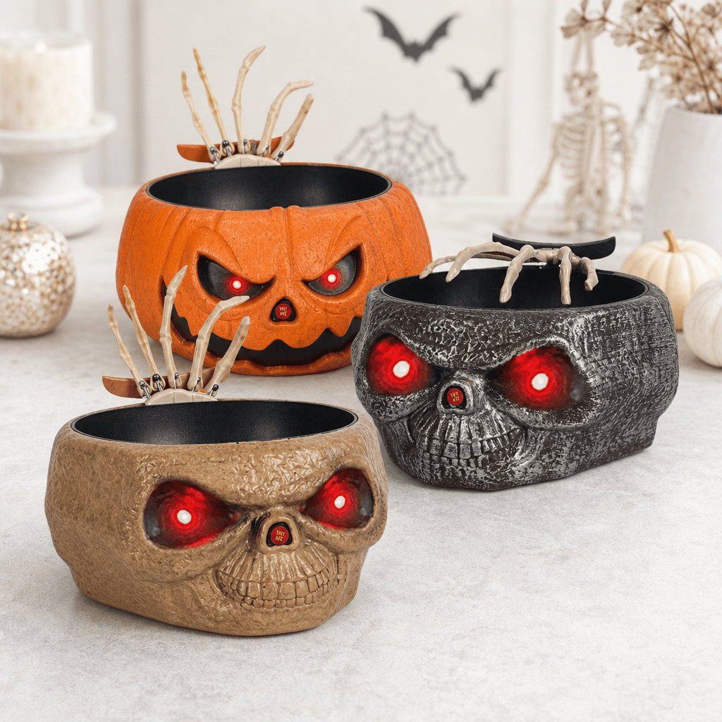 Tazón de dulces de Halloween con una mano móvil en el interior